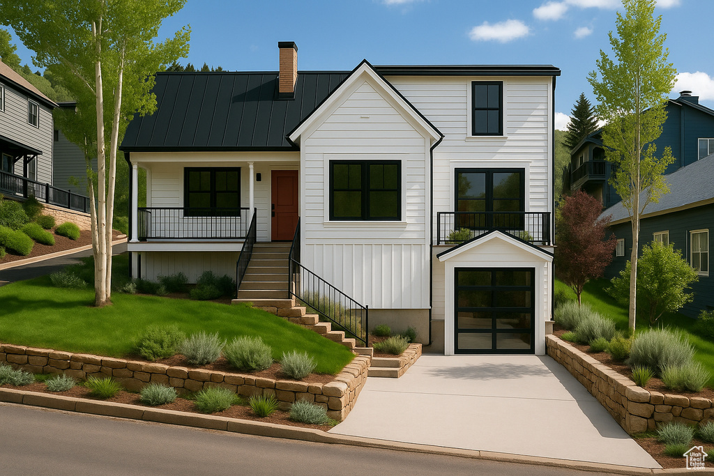 View of front of home featuring stairs, a chimney, concrete driveway, a standing seam roof, and a garage