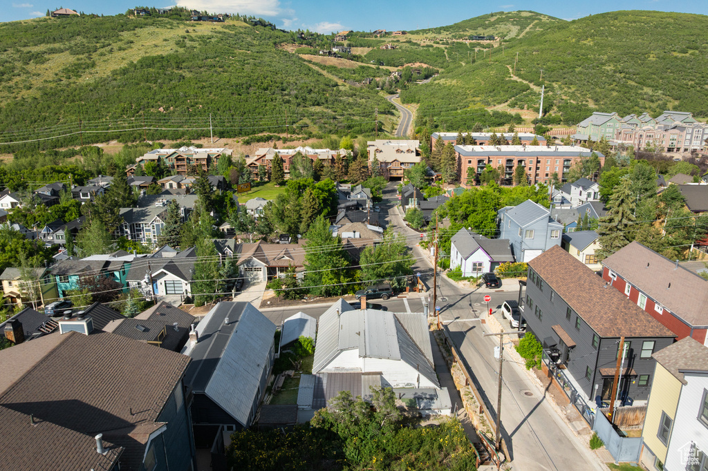 Aerial perspective of suburban area featuring a mountainous background