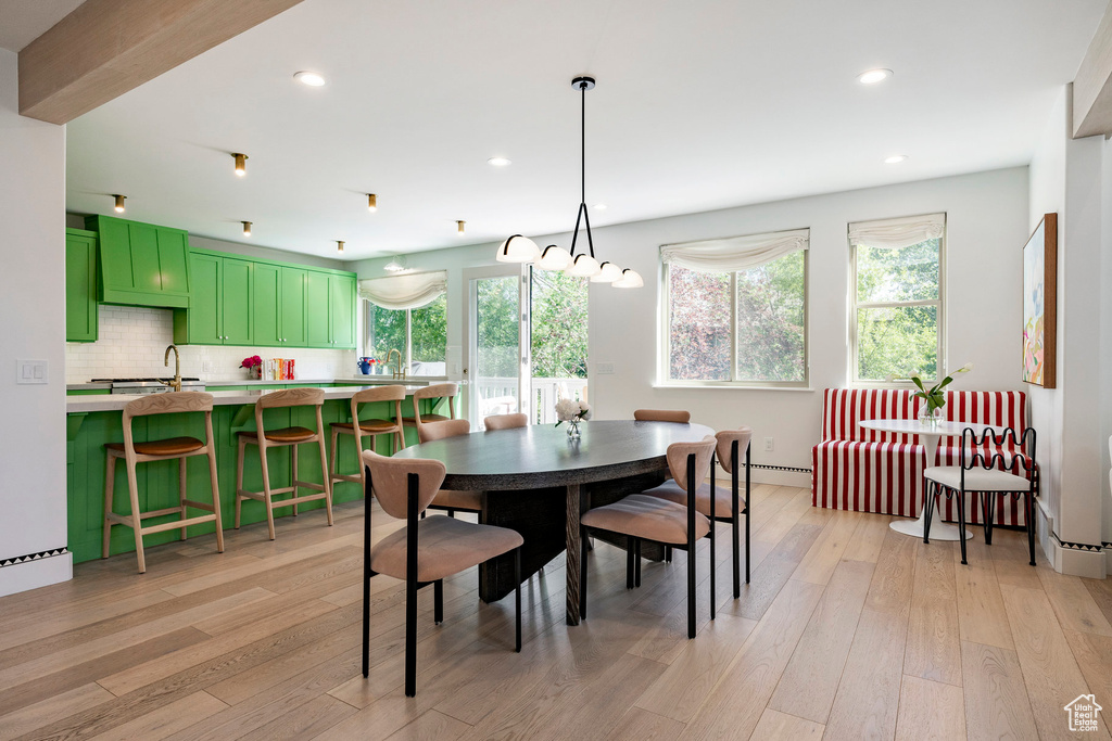 Dining room with recessed lighting and light wood-style floors