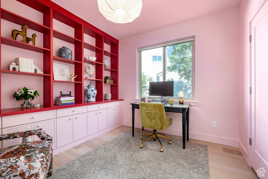 Office area featuring light wood finished floors and baseboards