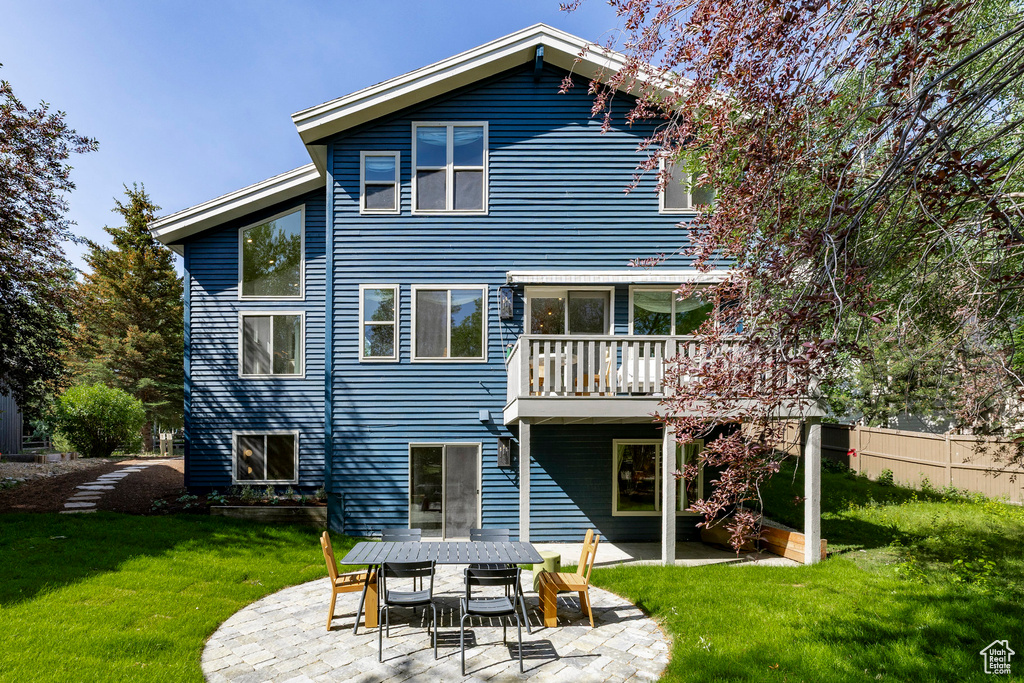 Back of house with a patio