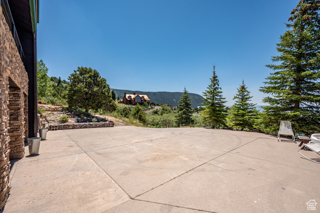 View of patio / terrace with a mountain view