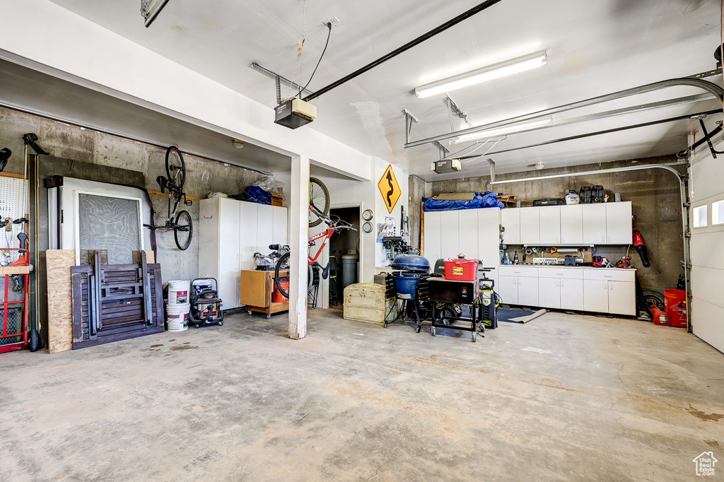 Garage featuring a garage door opener