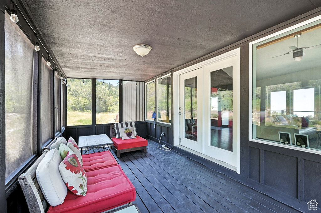 Sunroom with healthy amount of natural light and french doors