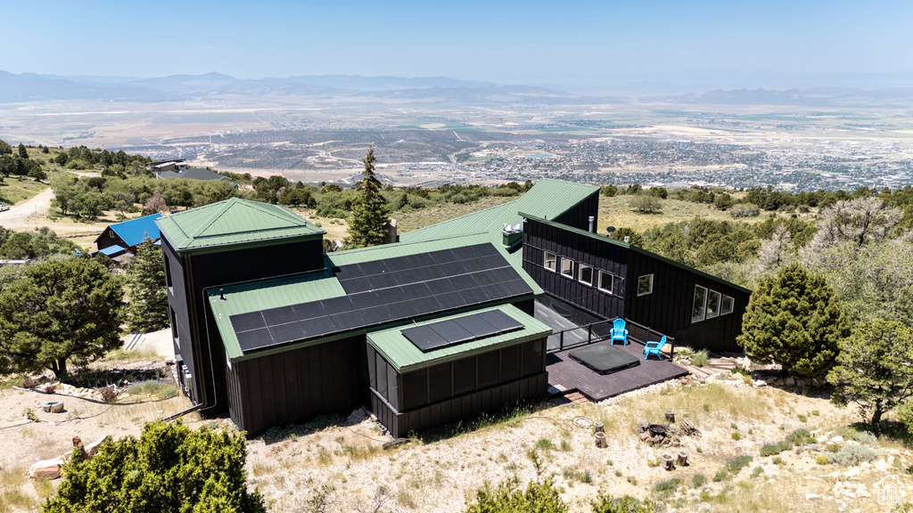 View from above of property with a mountain backdrop