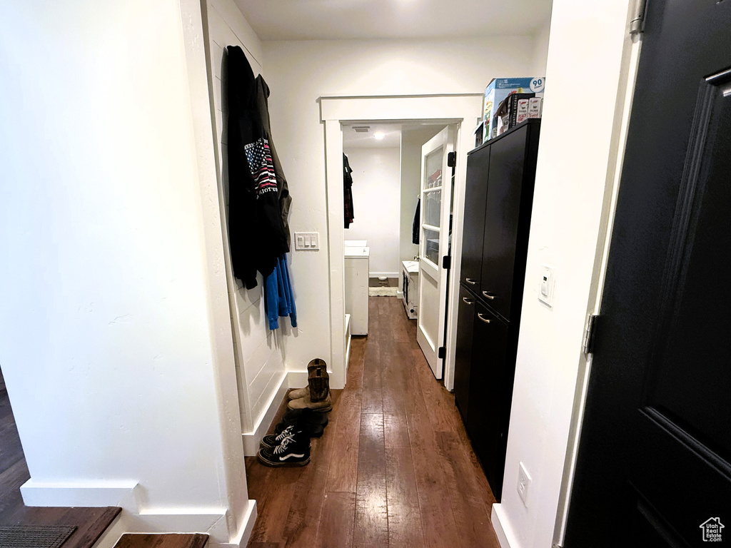 Corridor with hardwood / wood-style flooring