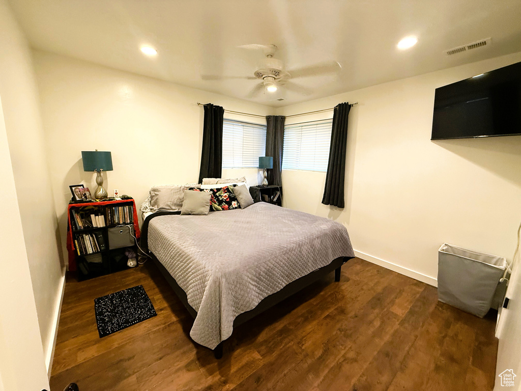 Bedroom featuring wood finished floors, ceiling fan, and recessed lighting
