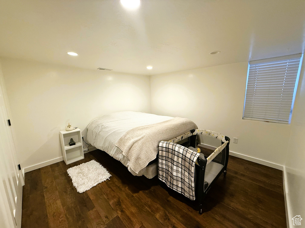 Bedroom featuring wood finished floors and recessed lighting