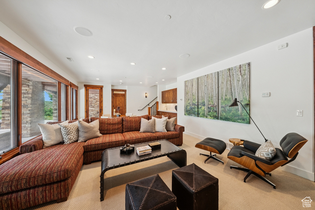 Living room featuring recessed lighting and light colored carpet