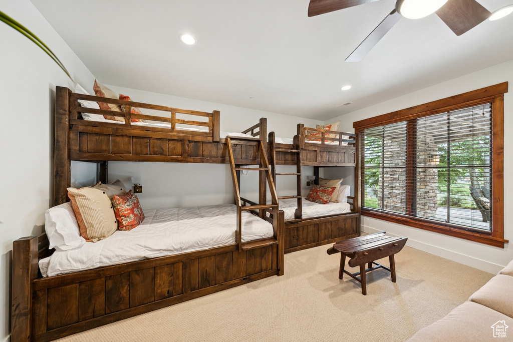 Carpeted bedroom featuring recessed lighting and ceiling fan