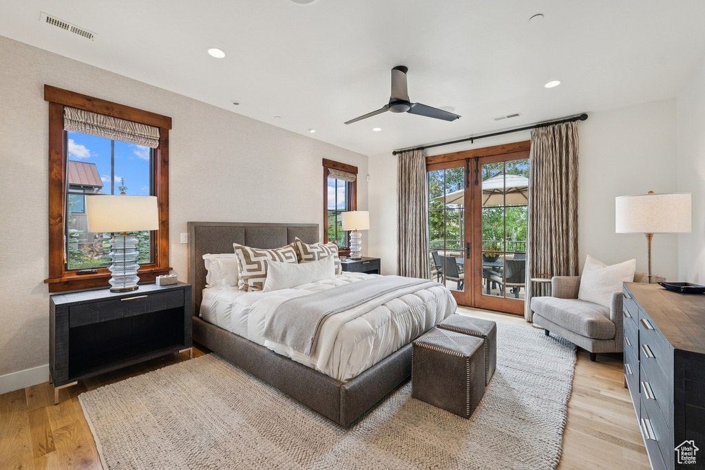 Bedroom featuring access to exterior, light wood-type flooring, recessed lighting, and ceiling fan
