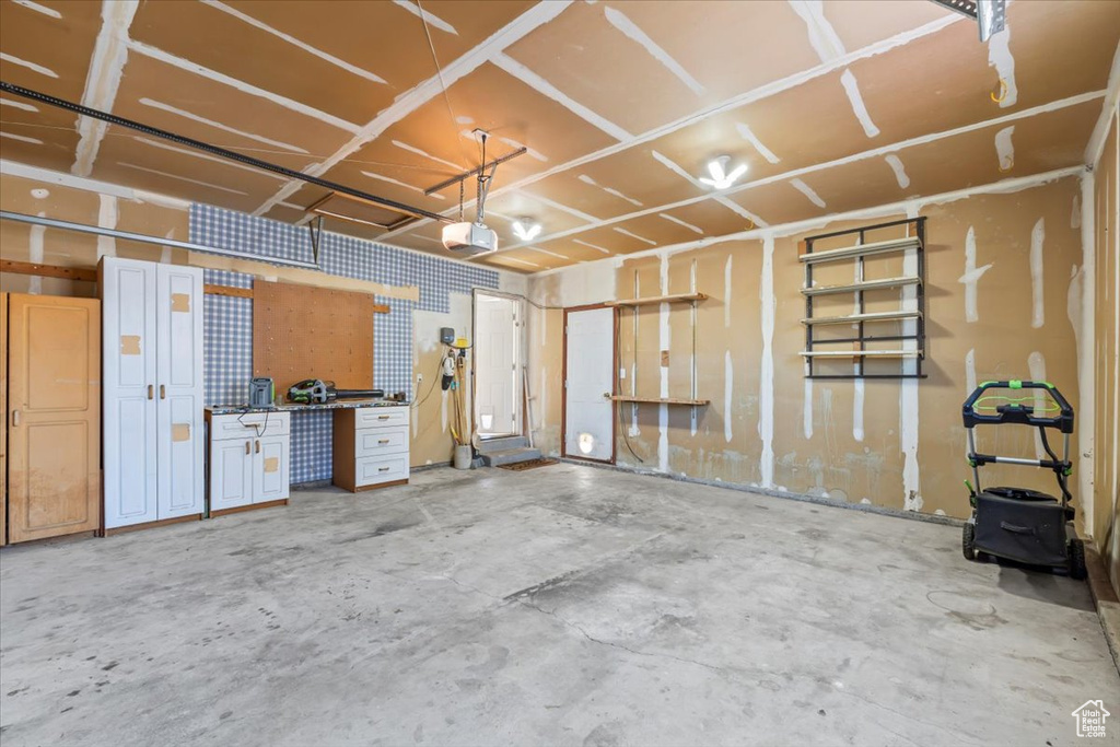 Garage featuring a garage door opener
