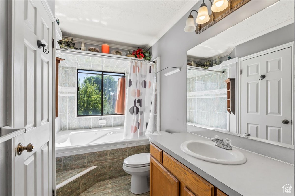 Bathroom with vanity and tiled shower / bath combo