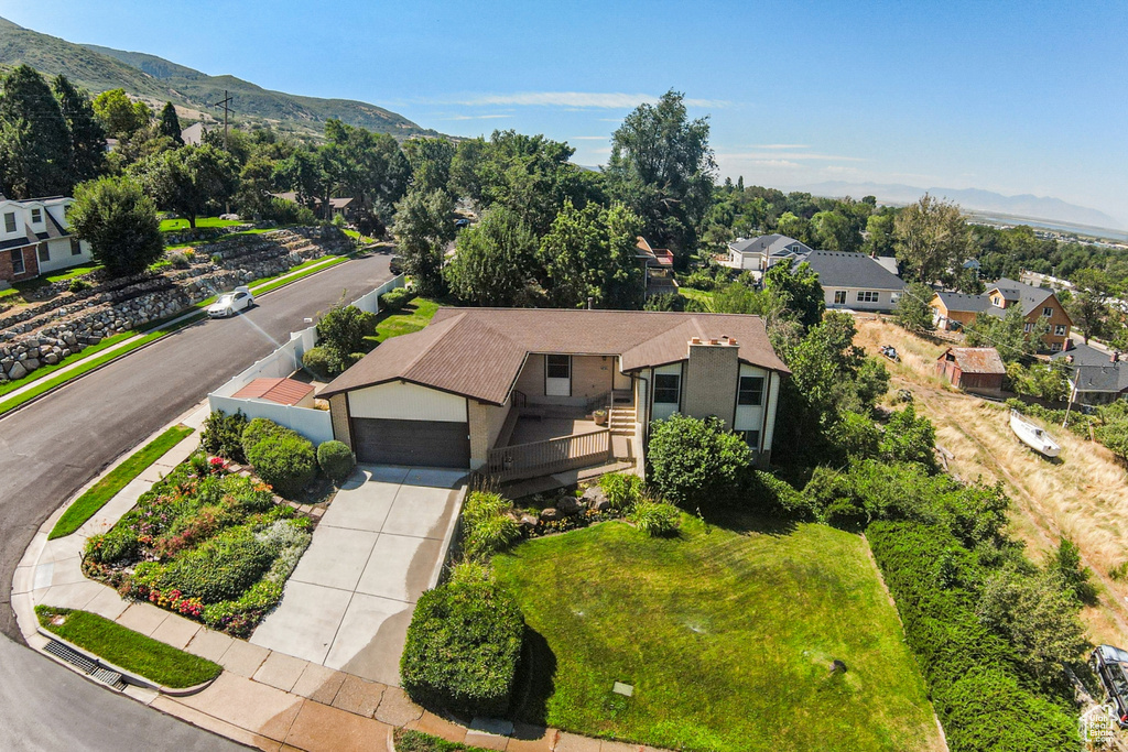 Aerial perspective of suburban area featuring a mountainous background