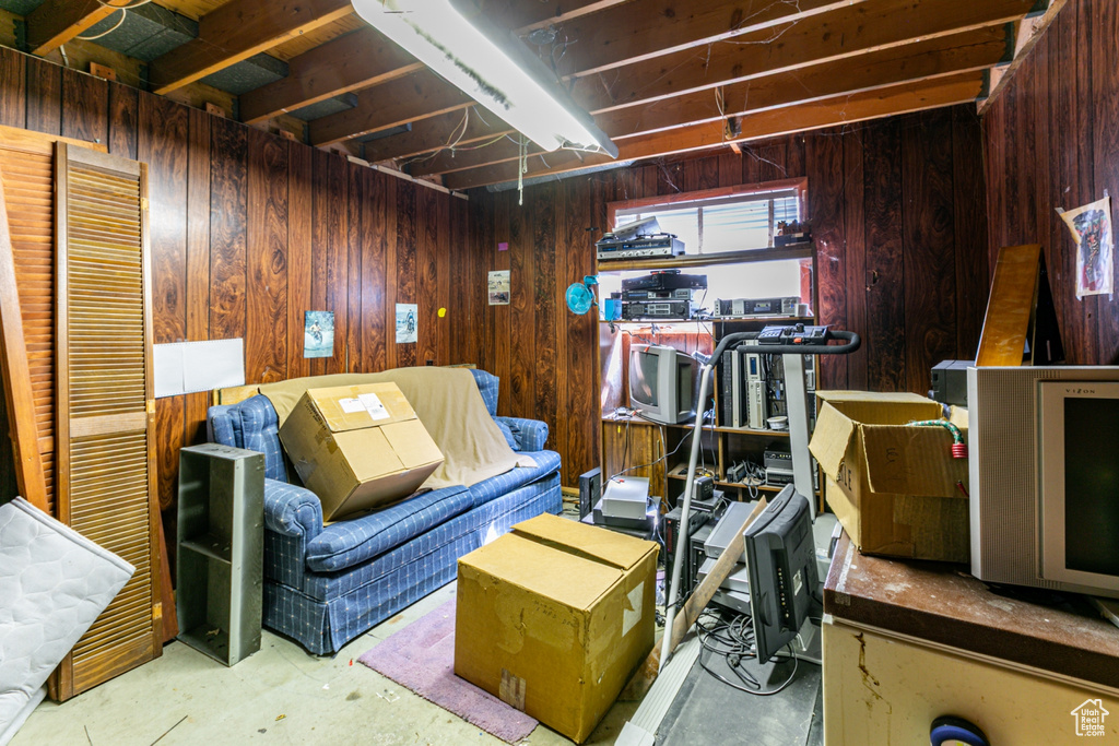 Below grade area featuring wooden walls