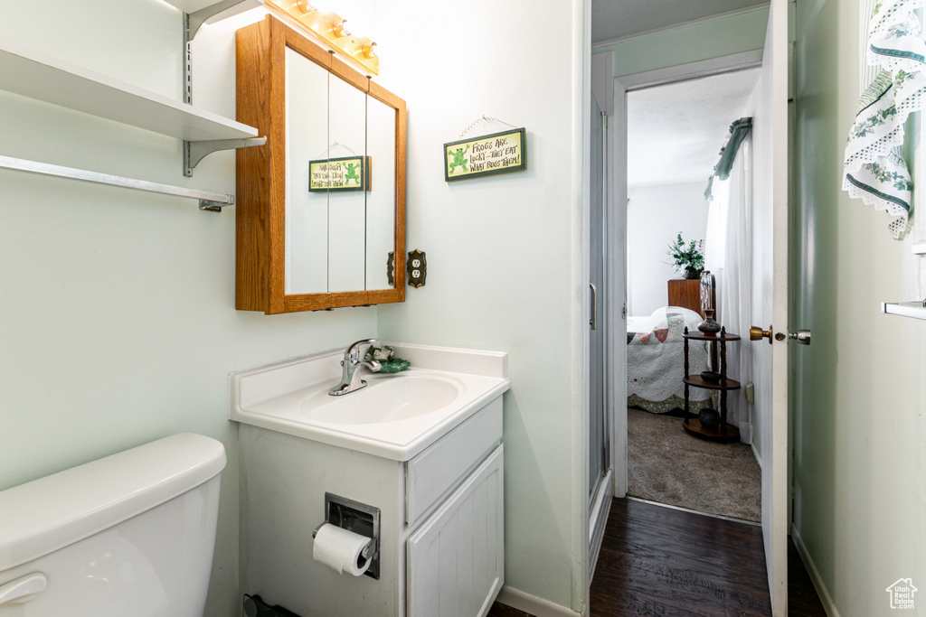 Bathroom featuring vanity and wood finished floors