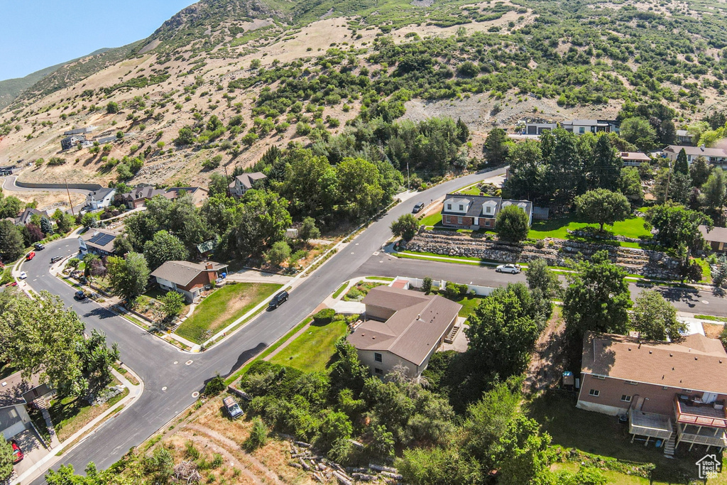 Aerial perspective of suburban area featuring a mountainous background
