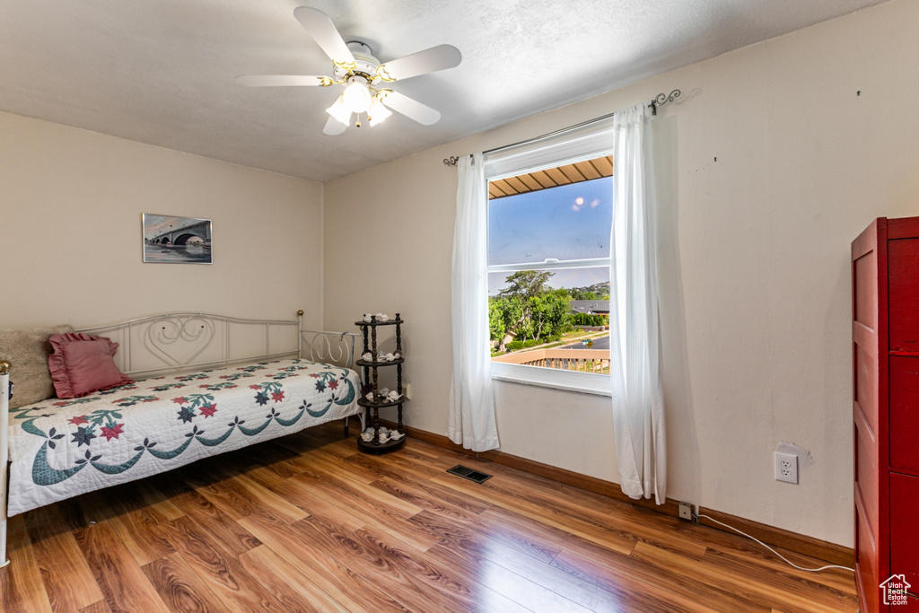 Bedroom featuring light wood-style floors and ceiling fan