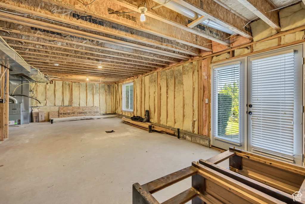 Basement featuring heating unit