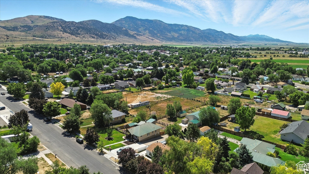 Aerial perspective of suburban area featuring a mountain backdrop