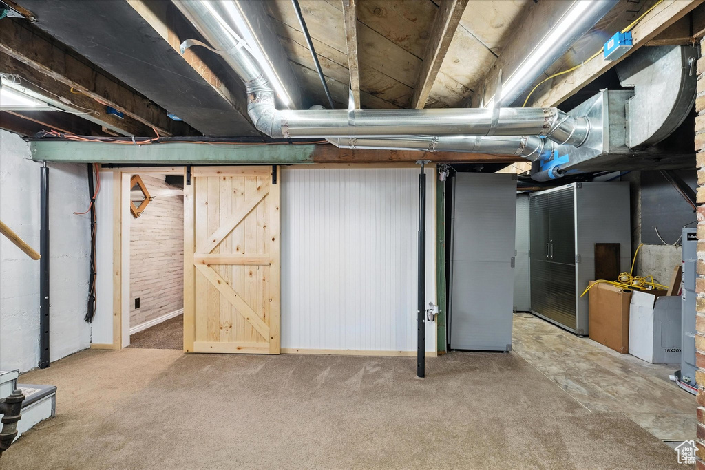 Unfinished below grade area with carpet flooring