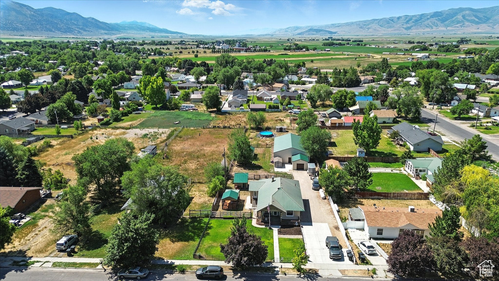 Aerial perspective of suburban area with a mountainous background