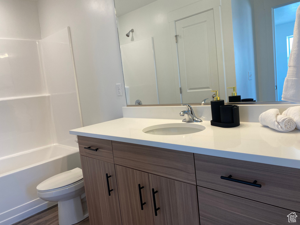 Bathroom with vanity and tub / shower combination