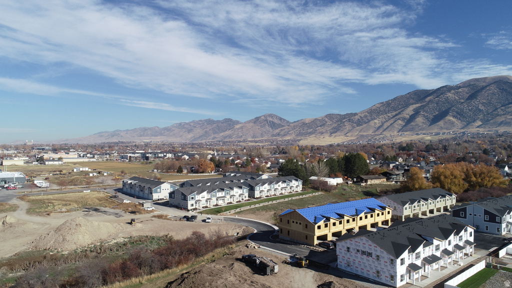 View of mountain backdrop featuring nearby suburban area