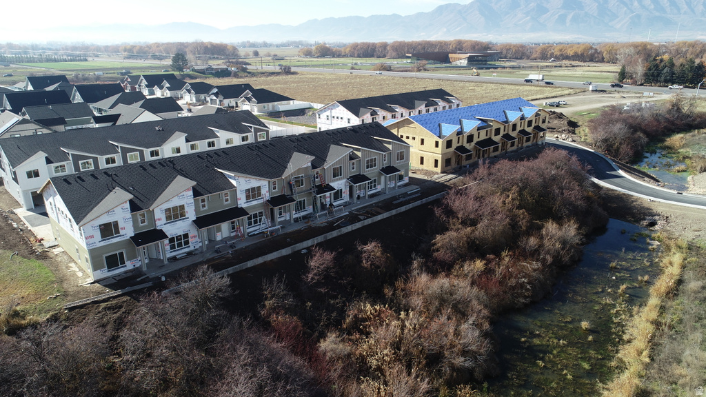 Aerial perspective of suburban area featuring a mountain backdrop