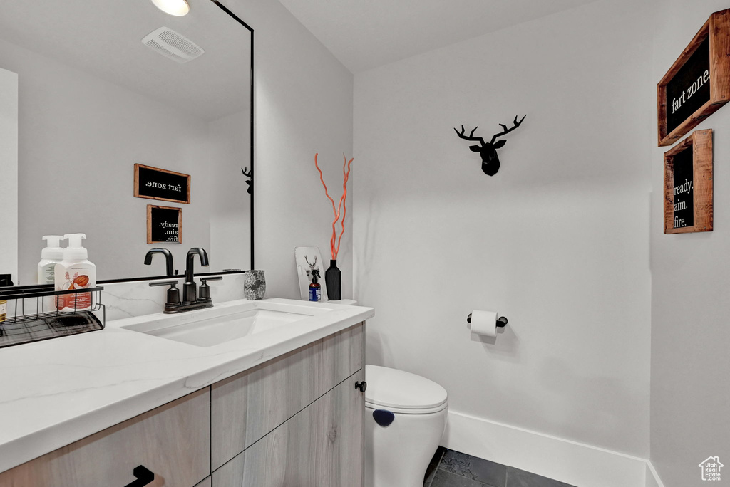 Bathroom featuring vanity and tile patterned floors
