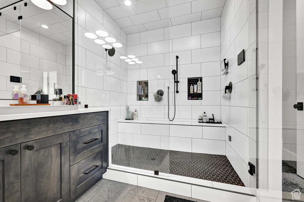 Full bathroom with a shower stall and vanity