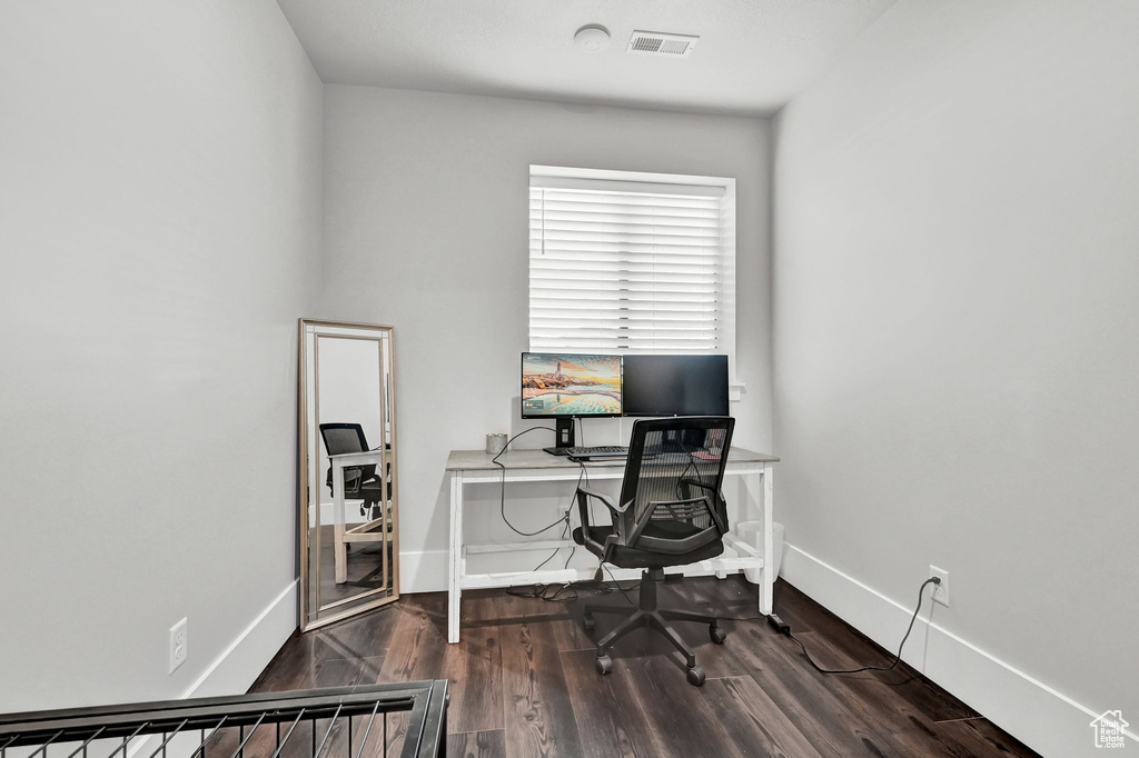 Office area with wood finished floors and baseboards