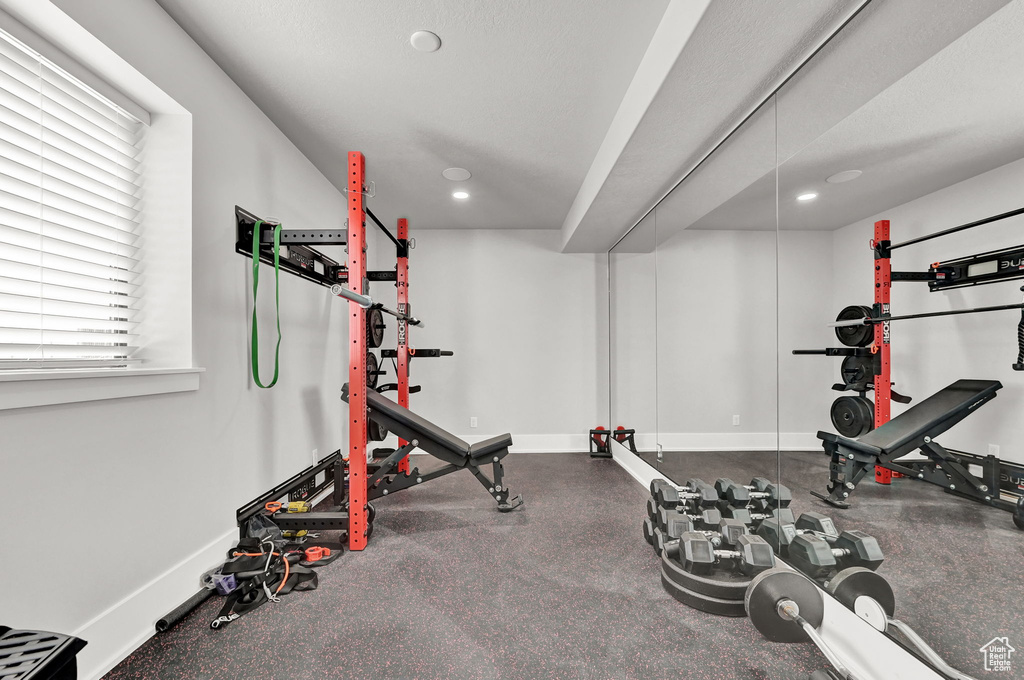 Exercise area with baseboards and recessed lighting
