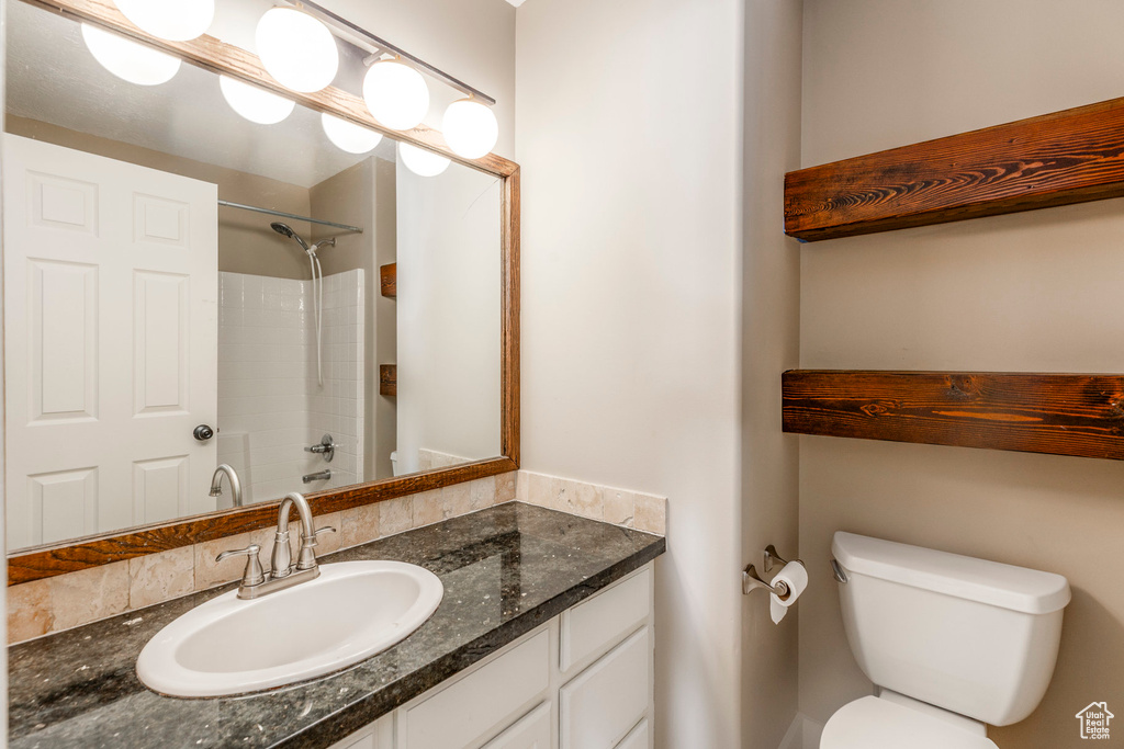 Bathroom with vanity and a shower