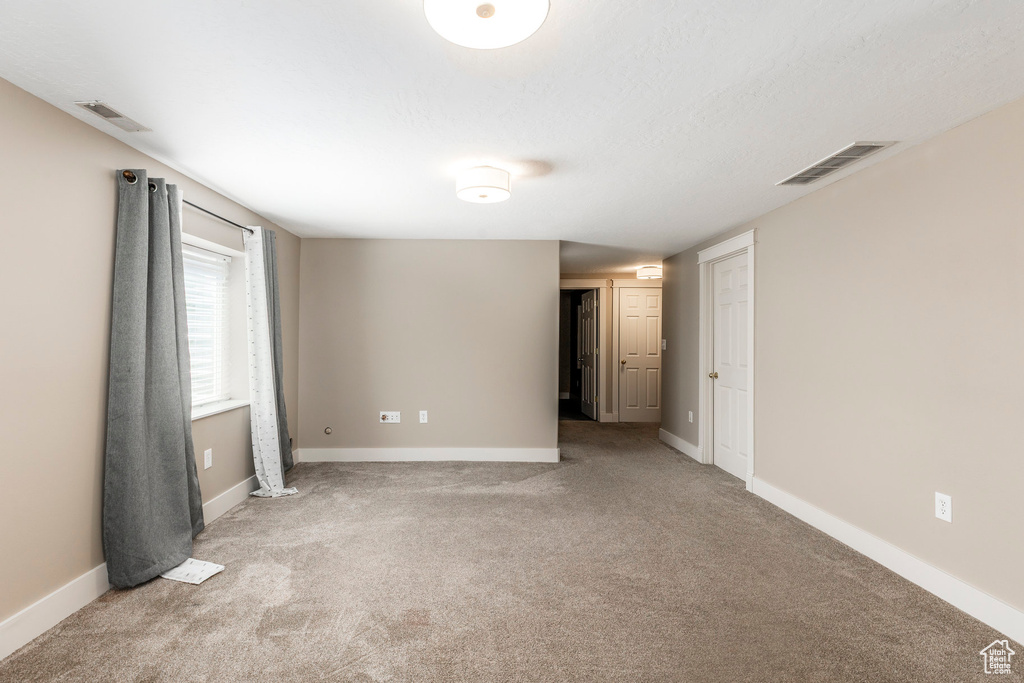 Spare room with carpet flooring and baseboards