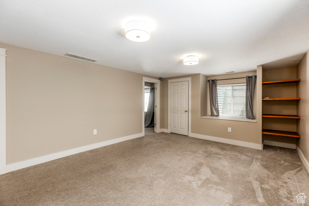 Unfurnished bedroom featuring carpet flooring
