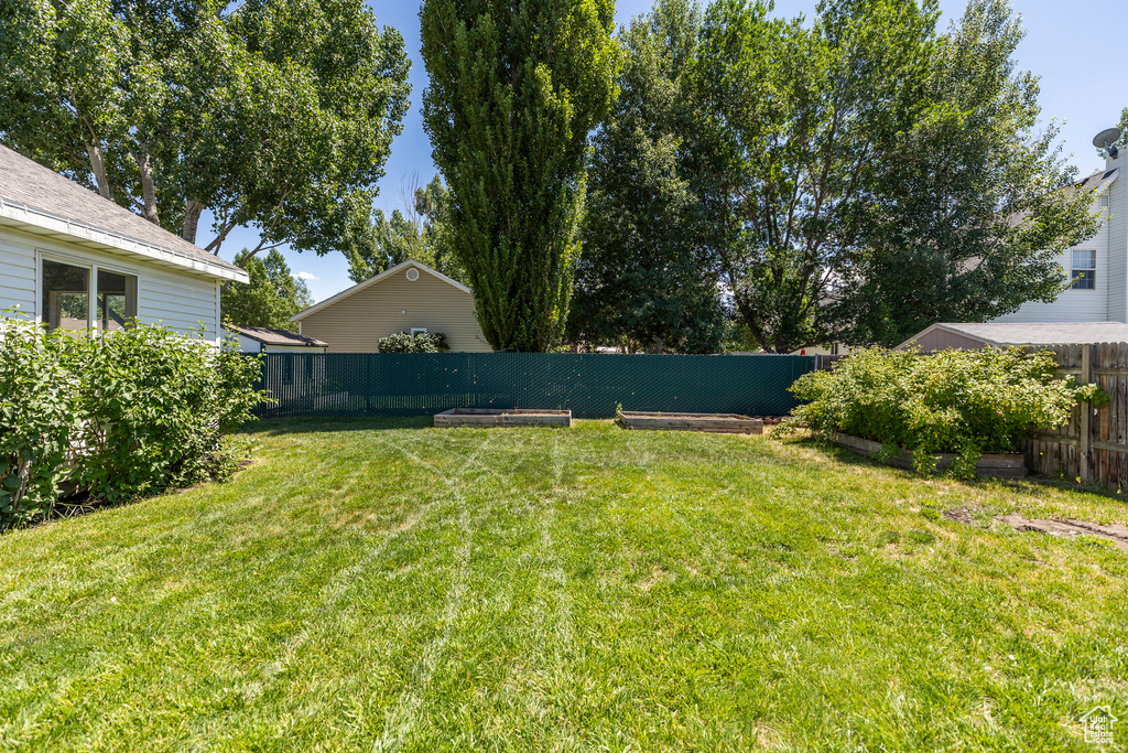 View of fenced backyard