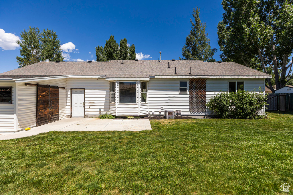 Rear view of property with a patio