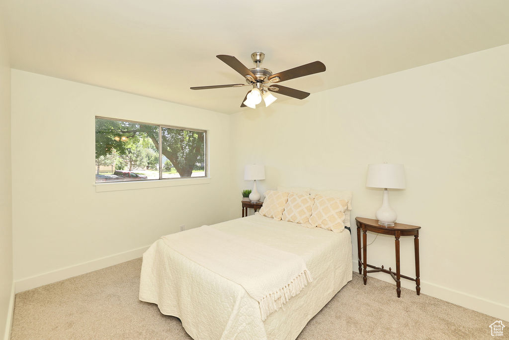 Bedroom featuring carpet and ceiling fan