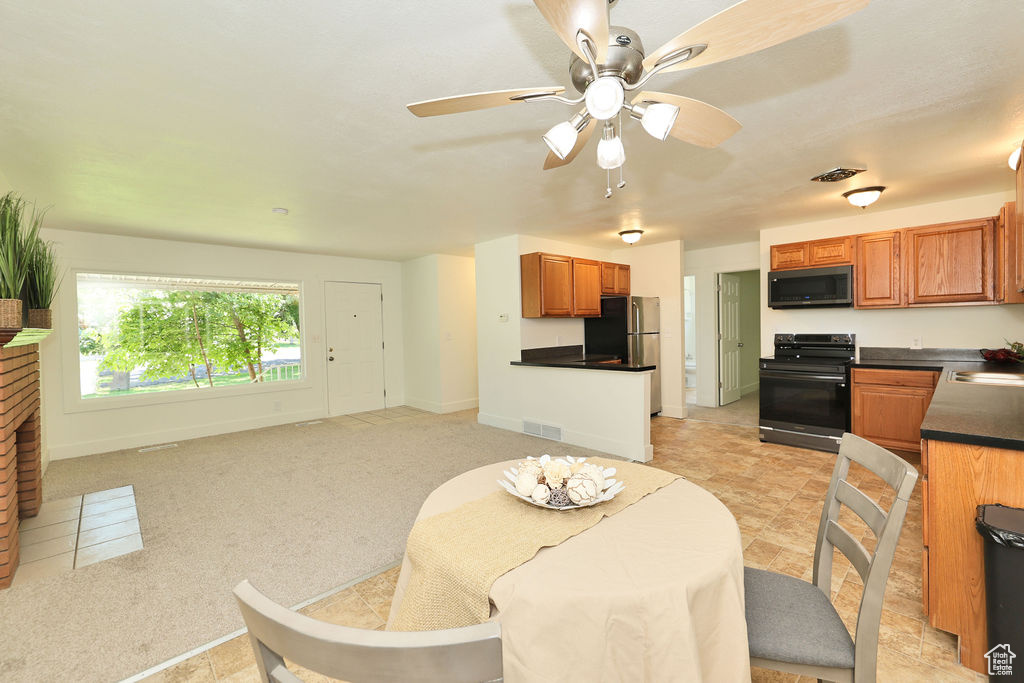 Dining room with baseboards and a ceiling fan