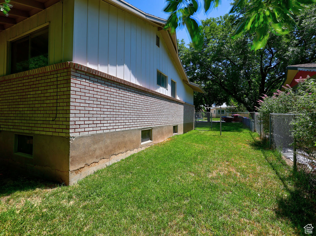 View of property exterior featuring brick siding