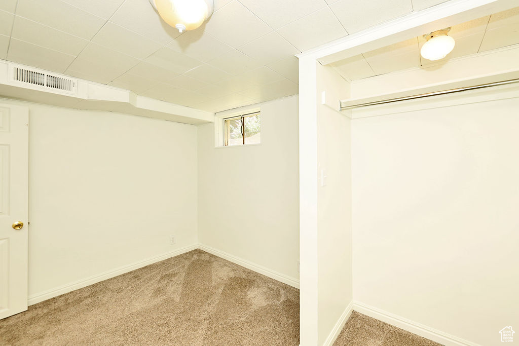 Below grade area with carpet and baseboards