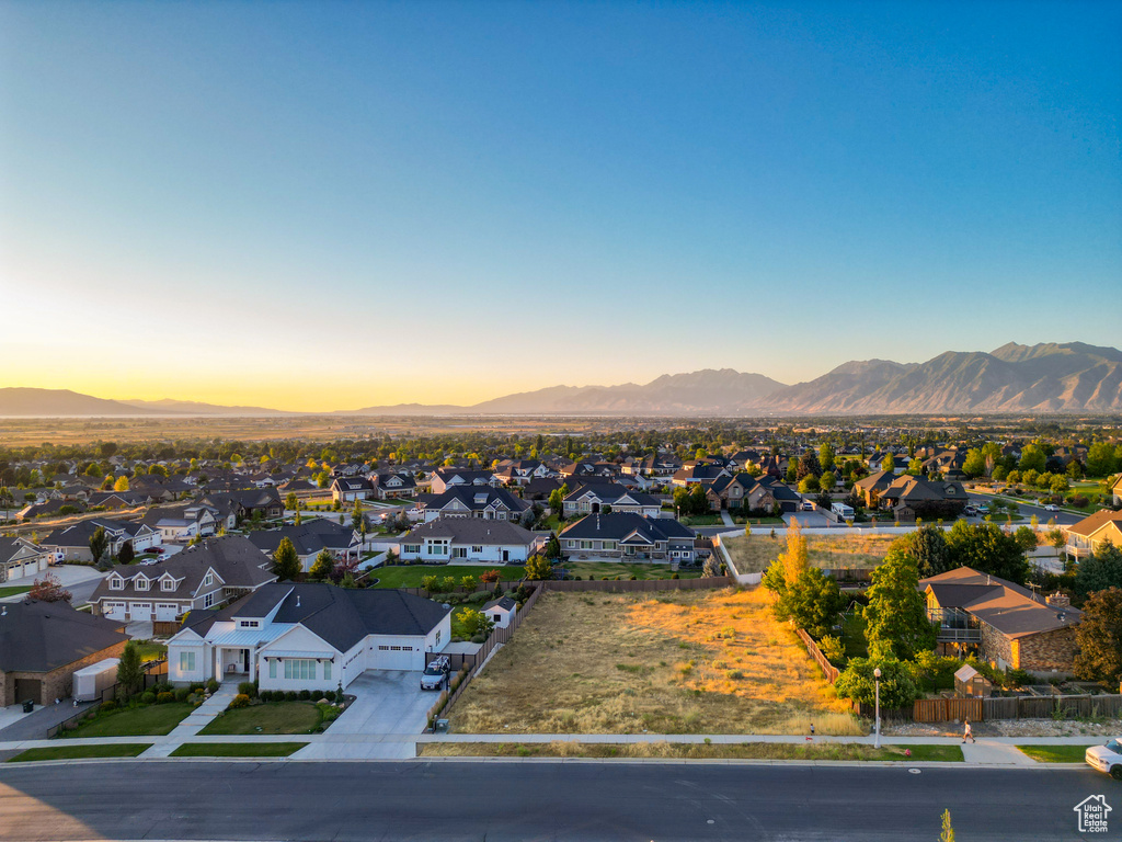 View of mountain backdrop featuring nearby suburban area