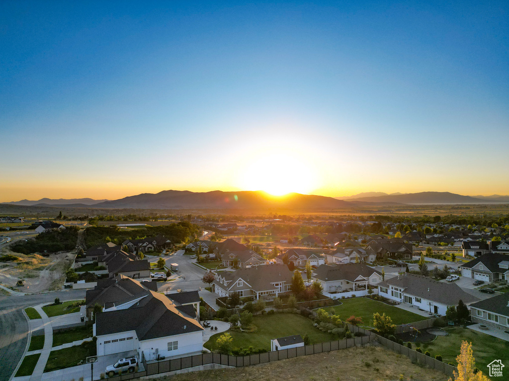 Aerial view at dusk of a residential view and a mountain view