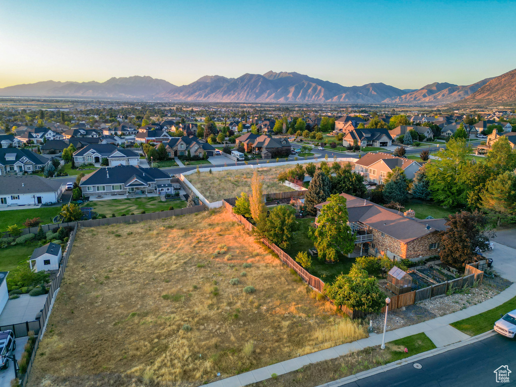 Aerial perspective of suburban area featuring a mountainous background