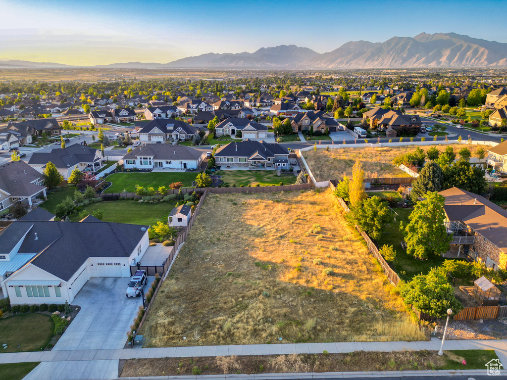 Aerial perspective of suburban area with a mountainous background