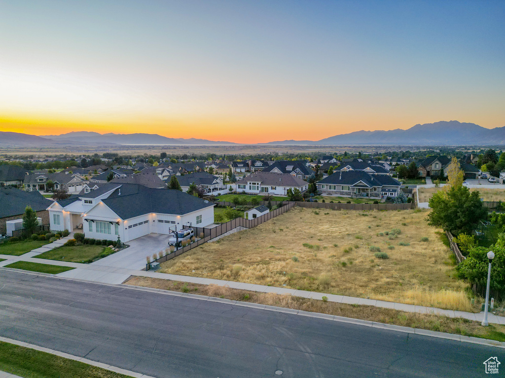 Aerial view of residential area featuring a mountainous background