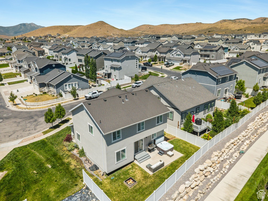 Aerial view of residential area with a mountainous background