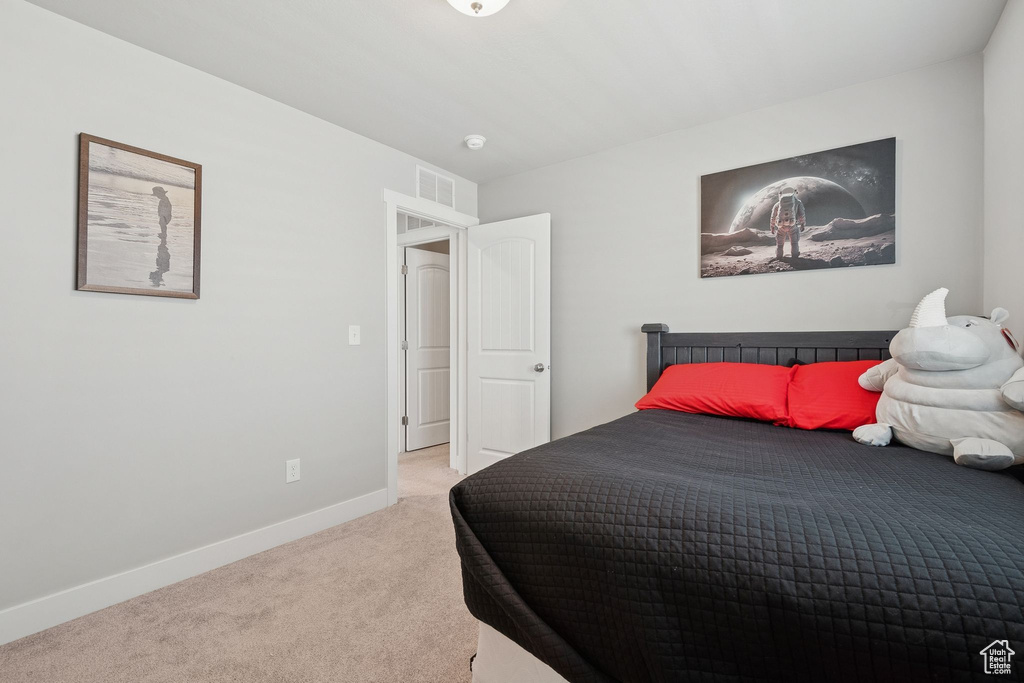 Bedroom with carpet and baseboards