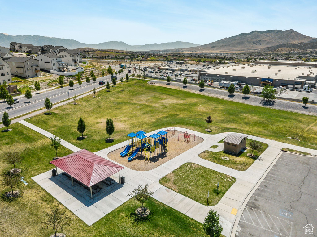 Drone / aerial view of a mountainous background and a community park